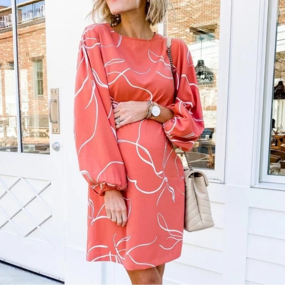A New Day Peach colored dress with white design and balloon sleeves- worn once